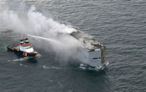 A car-carrying cargo ship burning near a Dutch bird habitat stokes environmental worries